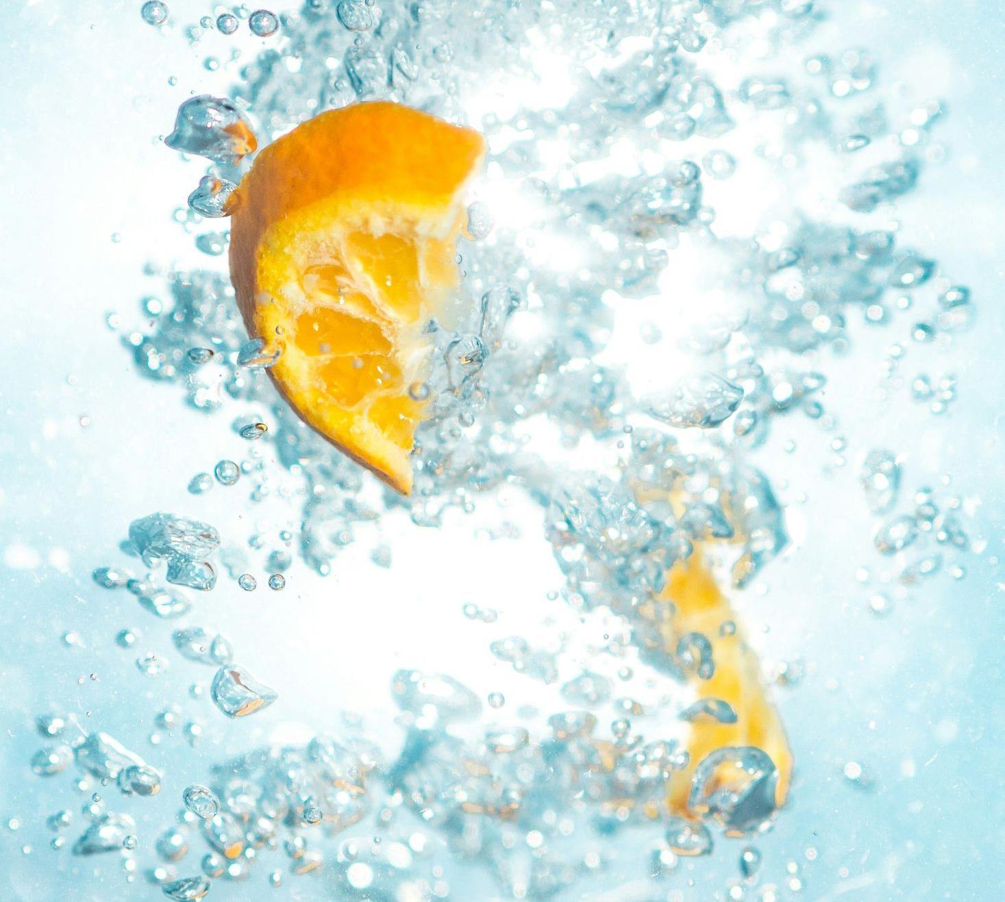 sliced orange fruits underwater